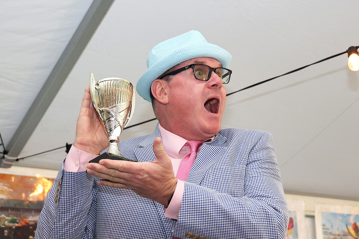 Man holding a trophy at the 2023 MPCF's KY Derby Celebration