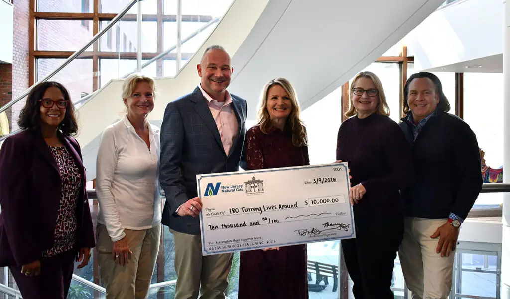 Group presents NJ Natural Gas check to 180 Turning Lives Around