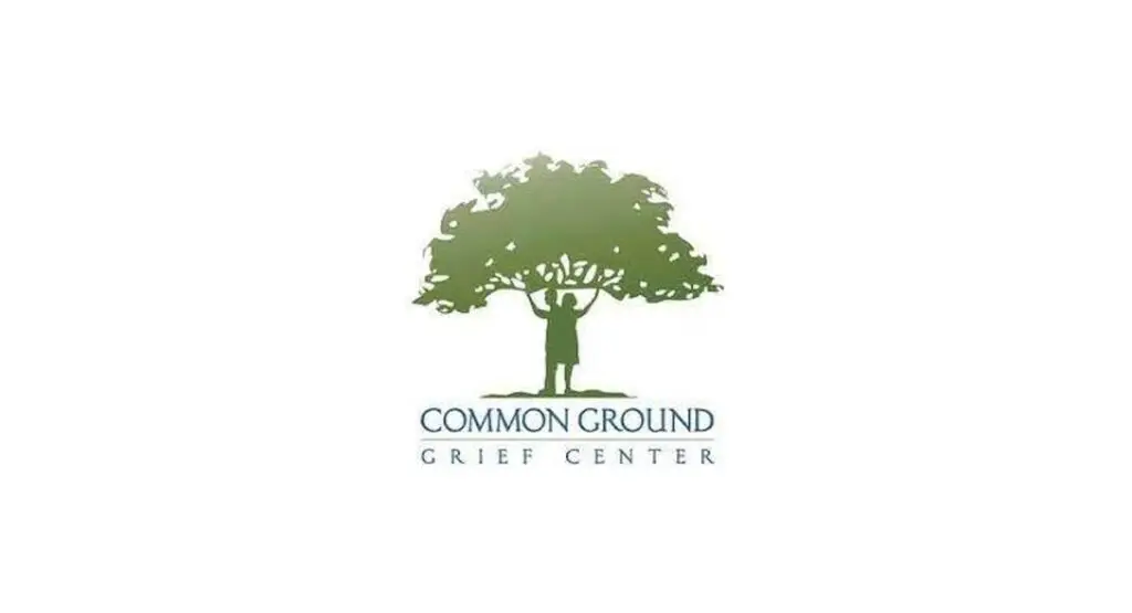 COMMON GROUND Grief Center logo: Silhouette of person supporting a tree, symbolizing support through grief.