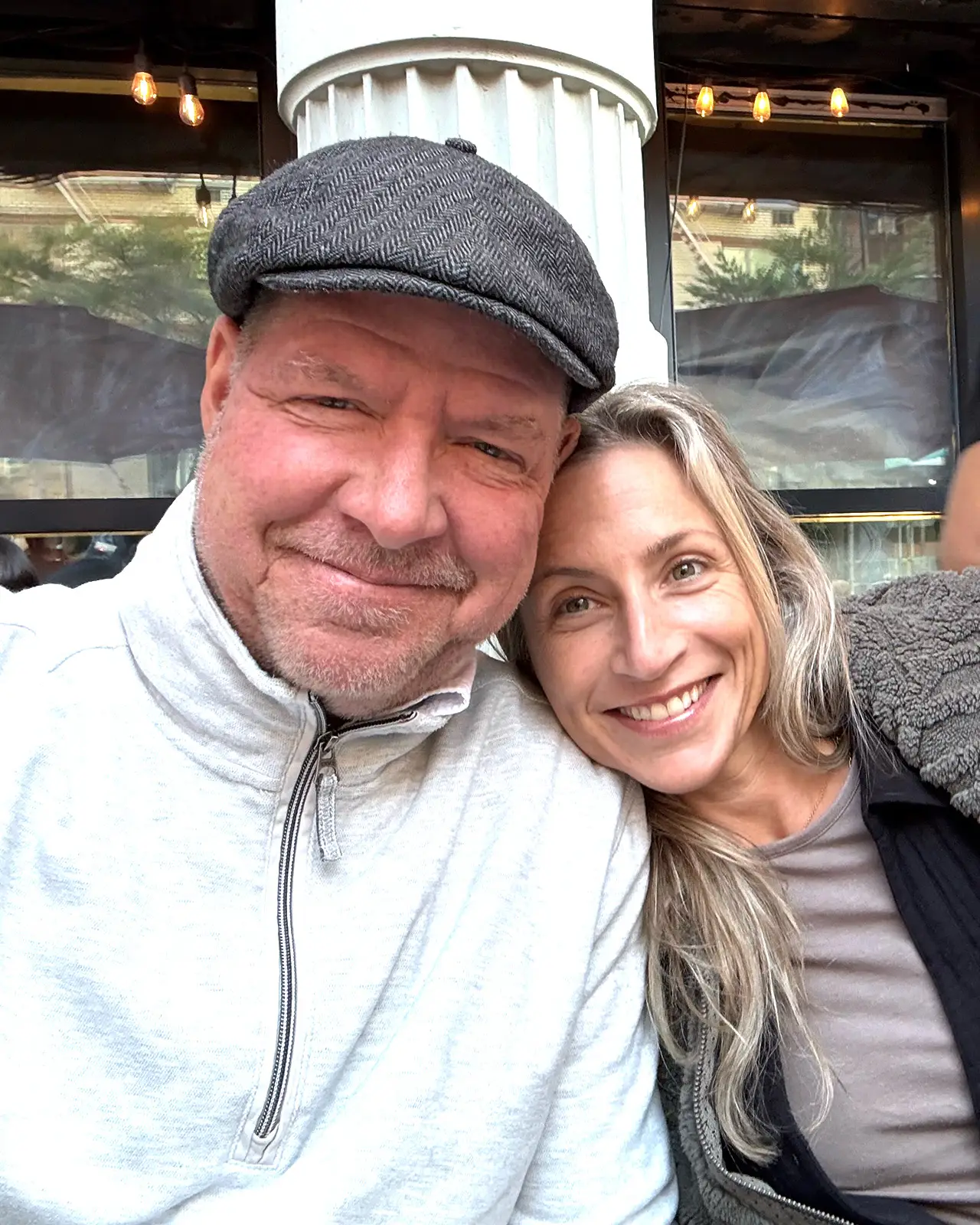 Smiling man and woman posing for a selfie.